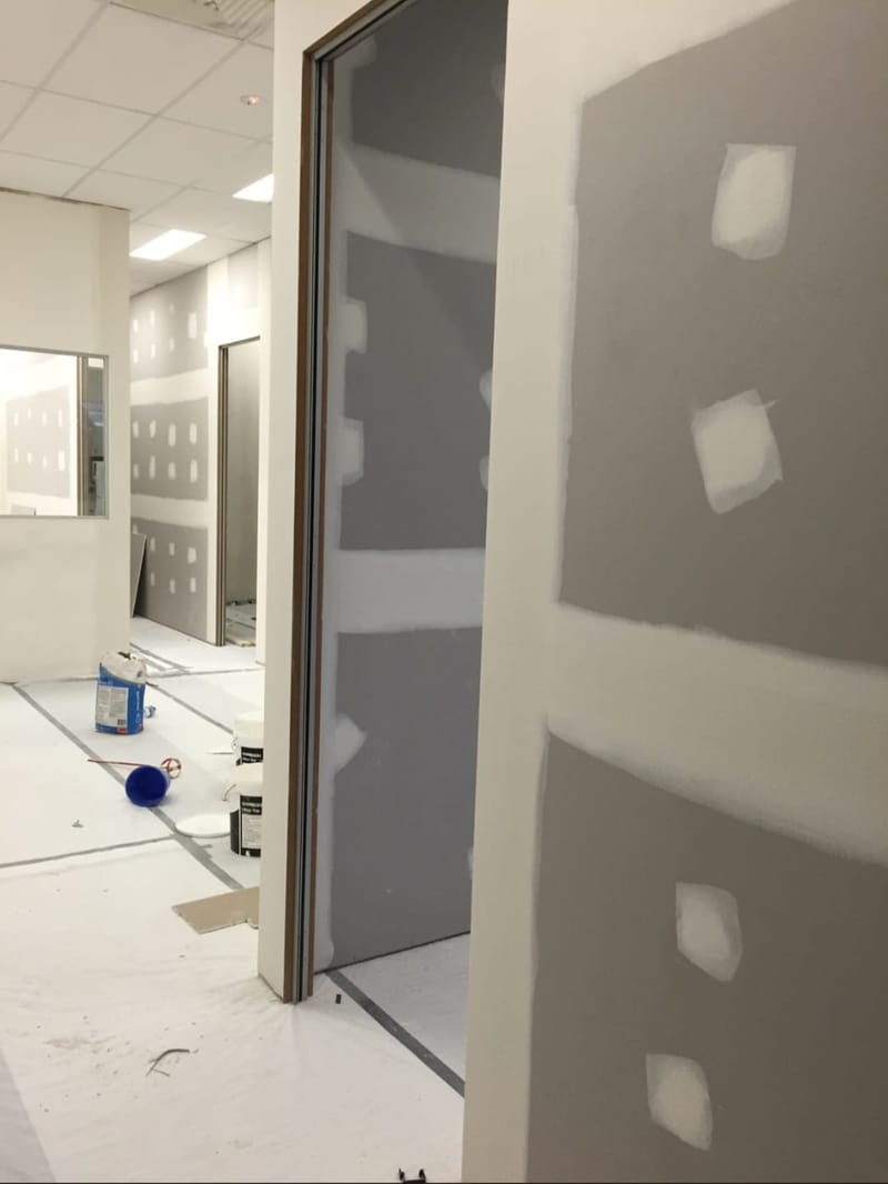 Lined partition walls dividing a refurbished space